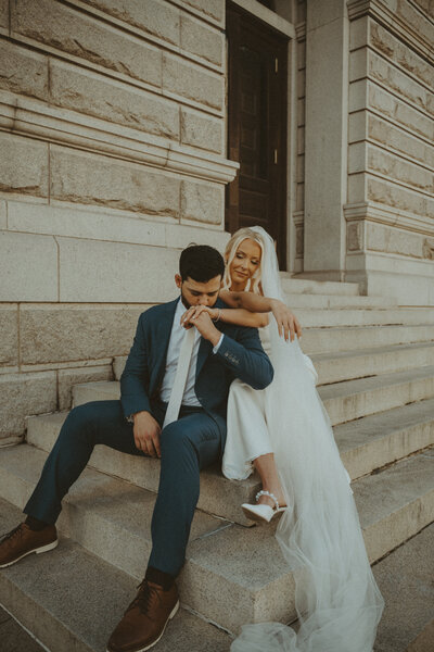 man embracing woman from behind