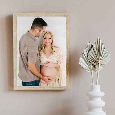 wood framed photo of pregnant couple in Springfield MO maternity photographer The XO Photography