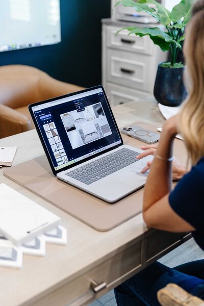 Expert interior design for homes during a renovation consultation using a laptop, offering professional guidance for home projects.