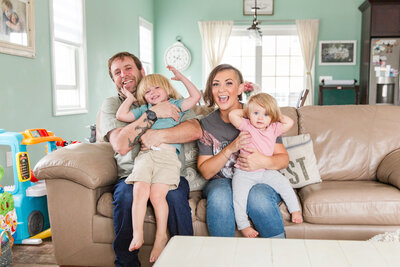 Marianne Bley and her family  playing on the couch