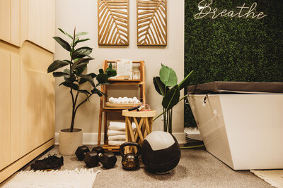 vIVId lounge with weights and bright white towels