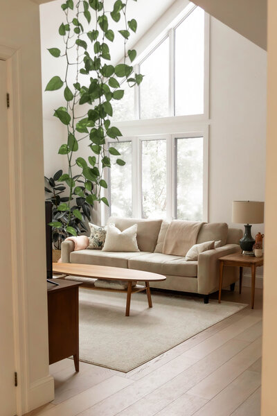 Bright and inviting interior of an Airbnb, beautifully designed by an interior designer. The photograph captures the stylish decor, thoughtful layout, and warm ambiance, highlighting the space’s unique character and design details.