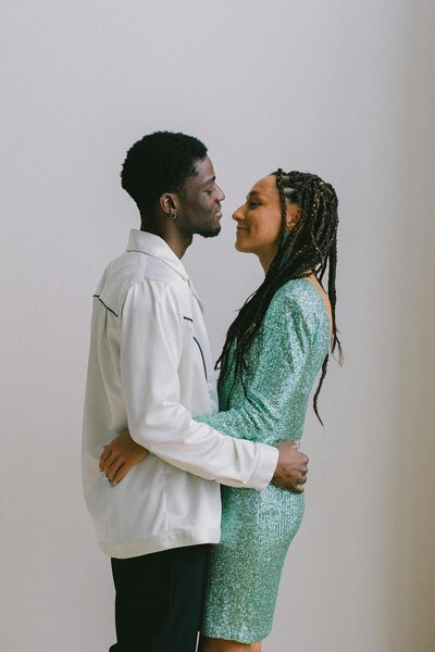 Black man and woman embracing and looking into each other's eyes