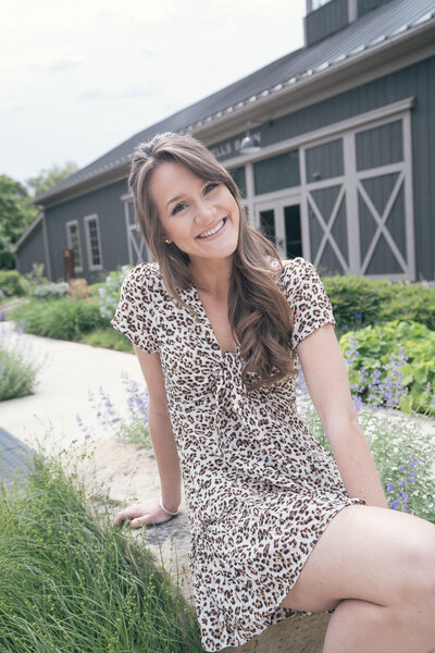 woman sitting outside smiling