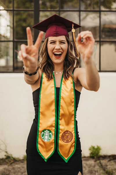 girl smiling in graduation cap