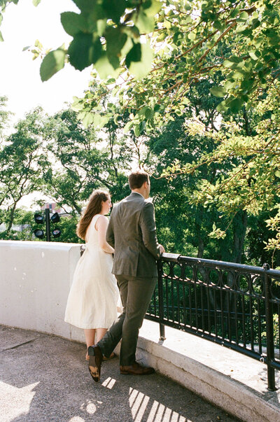 couple overlooks ceremony space at Prospect Part Boston elopement ceremony on film taken by boston documentary wedding photographer