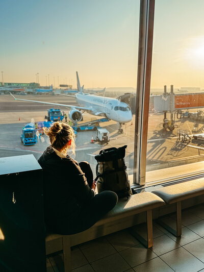 Destination wedding photograher waiting for her next flight