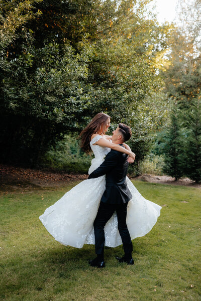 Oregon Wedding Photographer and Videographer Groom Spinning Bride Around in Arms