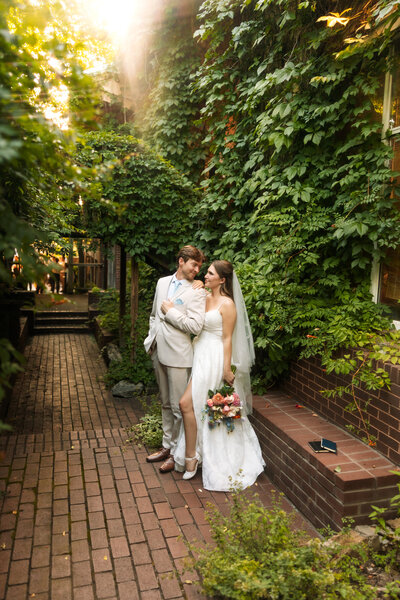 Bride surrounded by bouquets of flowers.