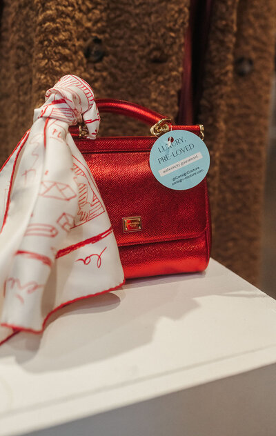 White hangers hanging on a small pole