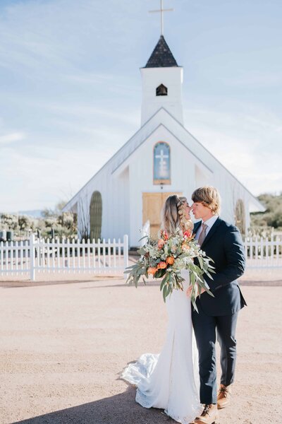 Lake Tahoe Elopement Photographer captures bride and groom in front of chapel