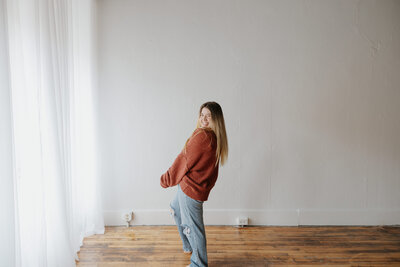 Jamie Tobin Photography posing in a clean white studio ready to talk to potential brides about their wedding day