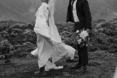 bride and groom kissing on beach