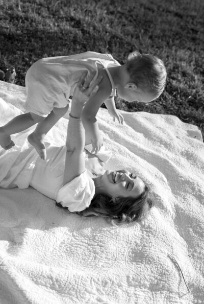 Mom holding up child taken by engagement photography florida, Shelby Ann Photos