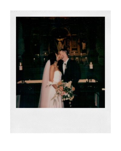 polaroid of a couple kissing shortly after getting married at brophy chapel in phoenix arizona
