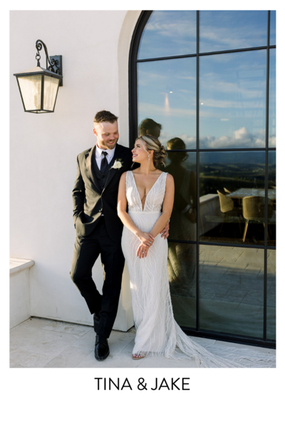 Bride and Groom standing together embracing each other