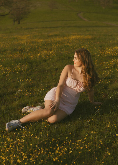 girl standing across Pittock Mansion in Portland, Oregon for senior photos