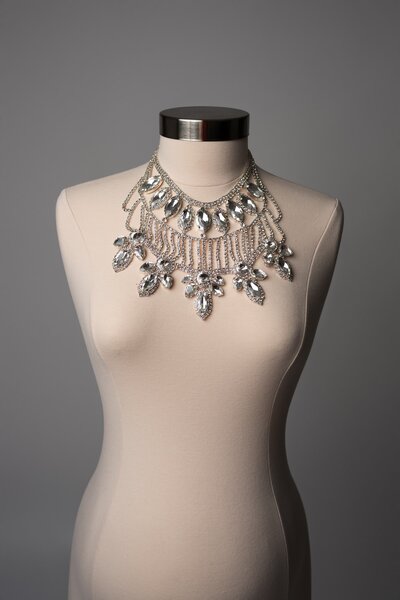 Studio photo of a statement crystal necklace accessory styled for maternity sessions – Hello Photography, Austin TX