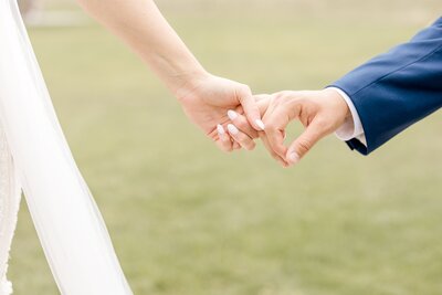 Closeup photo of wedding couple holding hands at Bavaria Downs wedding in Minneapolis.
