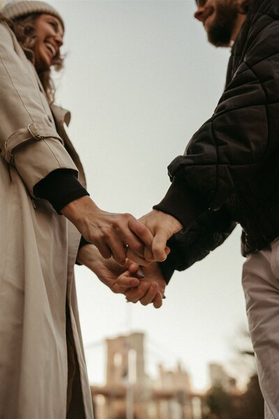 couple holding hands during couples photography session