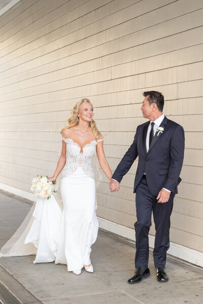 A bride and groom kissing each other