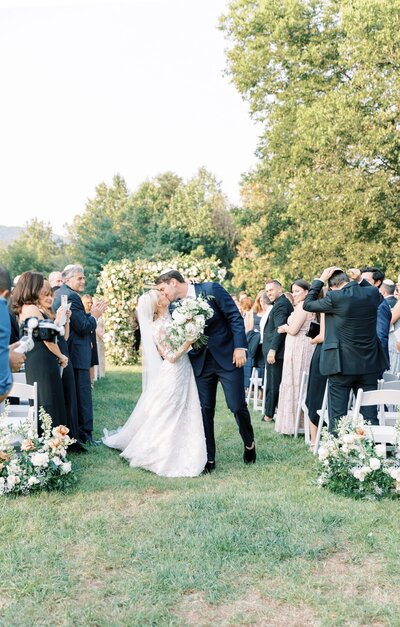 Bride walks down the isle with her dad