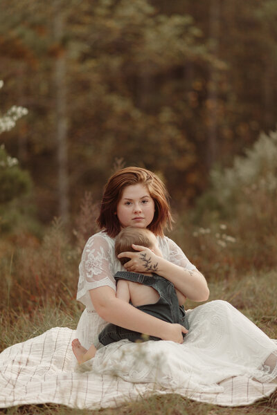 Mother and baby boy embrace by Lawrenceville Georgia Motherhood Photographer