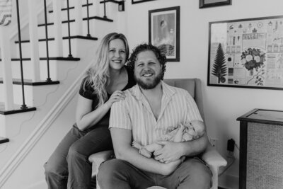 Black and white image of mother and father and their newborn baby in St. Louis, MO