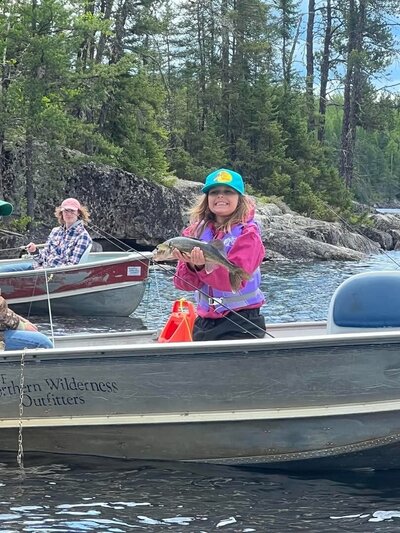 girl fishing at northern wilderness outfitters