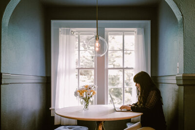 Business woman typing on laptop