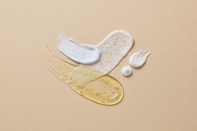Facial serums smeared on a paper