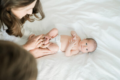 Vanessa Montano Photography captures tiny hands and feet of a newborn — Brentwood Newborn Photographer creating intimate, timeless portraits.