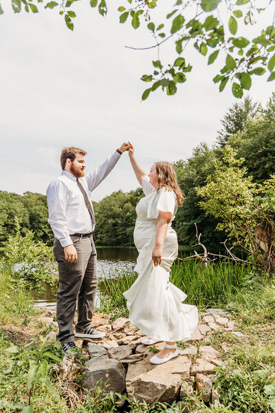 Groom twirls his bride after eloping