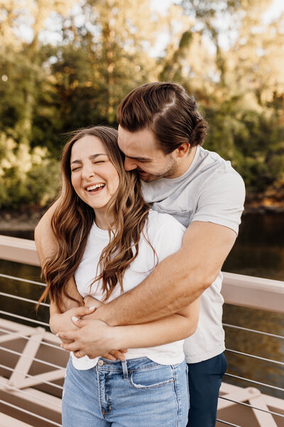 guy hissing girl's cheek