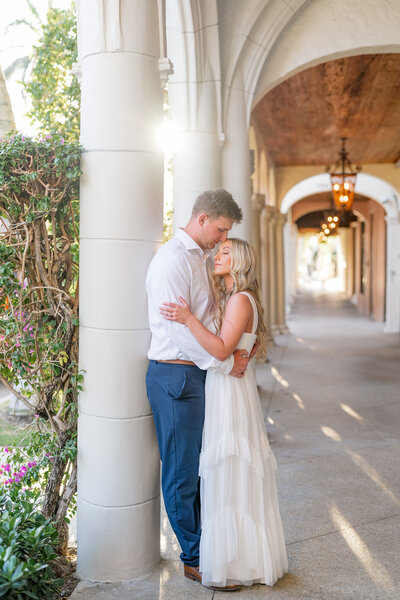 Couple embracing under column walkway