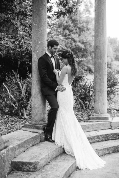 Groom holds his bride after wedding ceremony in Wilmington NC.