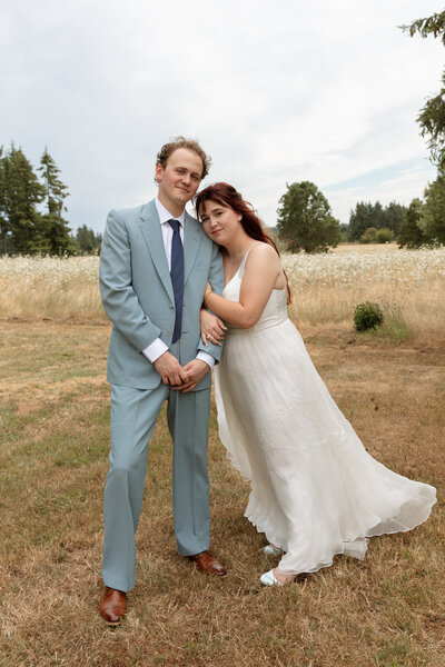 Wedding portraits showcasing a couple embracing outdoors.