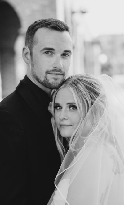 a close up image of a bride and groom in black and white