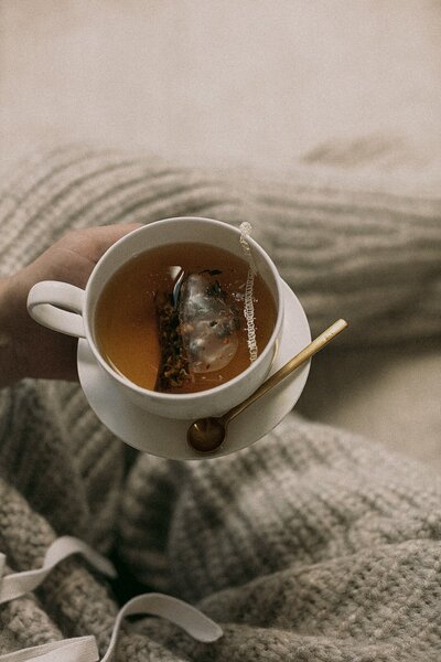 Woman holding a cup of hot tea