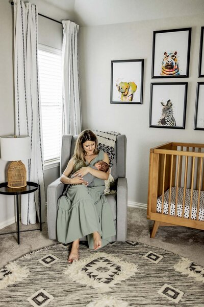 Dad holds baby girl at a home session in Plano Texas
