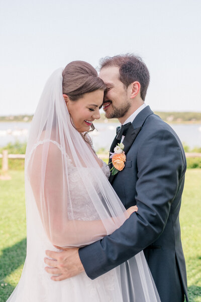 Cape cod wedding couple snuggling