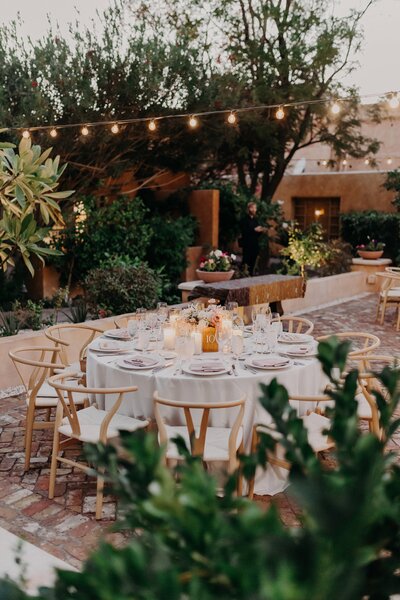 Wedding reception table nestled in spanish inspired venue