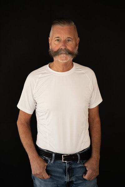 Studio shot of Chuck Podesta modeling western fashion in Reno, NV