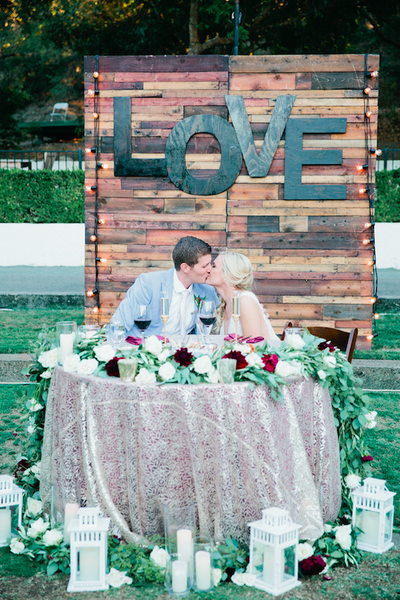 Elegant table settings with floral centerpieces and soft lighting create a romantic ambiance.