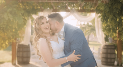 A happy couple just married, celebrating their love at a reception in Wasco, California.