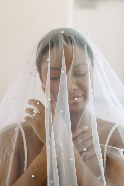 A solo portrait of a bride with her veil on for a Notre Dame Basilica Church wedding in Ottawa.