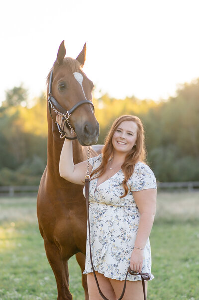 woman touching her horse's face