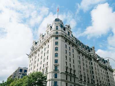 Willard intercontinental in DC  with american flag and blue sky