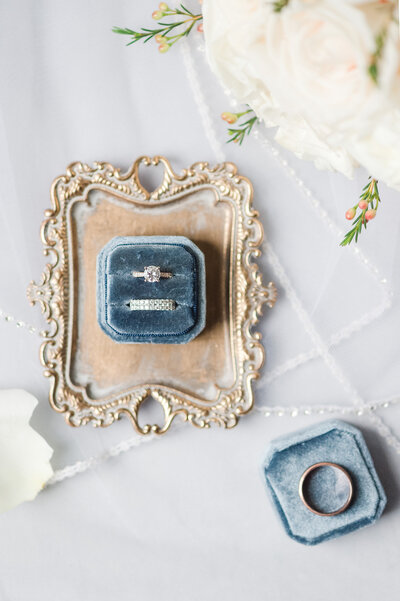 Bridal wedding bands and engagement ring flatlay detail photo