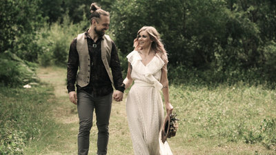 Wedding videography shoot of couple walking in  woodland at The Dreys wedding venue, Kent